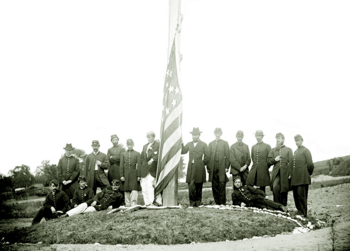 A Signal Corps flagman signaling in the field during the Civil War